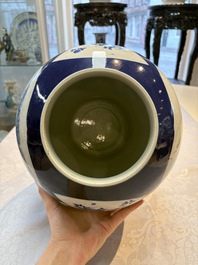A Chinese blue and white powder-blue-ground 'He Xiangu 何仙姑' vase and cover, 19th C.