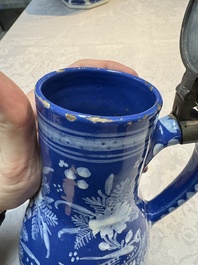A Nevers white-decorated Persian-blue-ground faience jug with a mounted pewter lid, France, 18th C.