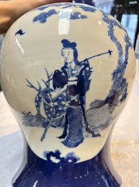 A Chinese blue and white powder-blue-ground 'He Xiangu 何仙姑' vase and cover, 19th C.