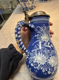A Nevers white-decorated Persian-blue-ground faience jug with a mounted pewter lid, France, 18th C.
