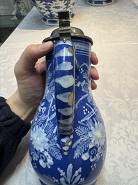 A Nevers white-decorated Persian-blue-ground faience jug with a mounted pewter lid, France, 18th C.