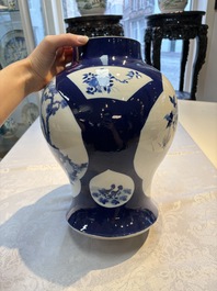 A Chinese blue and white powder-blue-ground 'He Xiangu 何仙姑' vase and cover, 19th C.