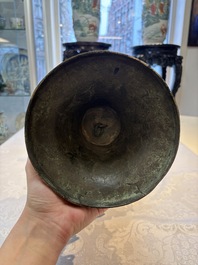 A Chinese archaistic bronze 'Zun' vase with 99 rings, 18/19th C.