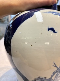 A Chinese blue and white powder-blue-ground 'He Xiangu 何仙姑' vase and cover, 19th C.
