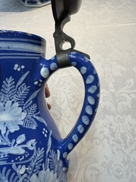 A Nevers white-decorated Persian-blue-ground faience jug with a mounted pewter lid, France, 18th C.