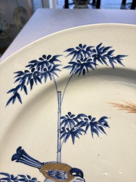 A large Chinese blue and white gilt-decorated dish with birds and insects among bamboo and peonies, Yongzheng