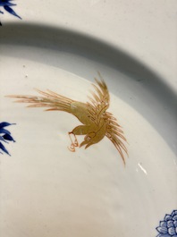 A large Chinese blue and white gilt-decorated dish with birds and insects among bamboo and peonies, Yongzheng