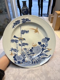A large Chinese blue and white gilt-decorated dish with birds and insects among bamboo and peonies, Yongzheng