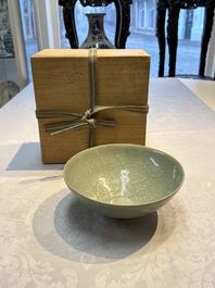 A fine Korean celadon moulded 'Peony Scroll' bowl with a wooden box, Goryeo, 13th C.
