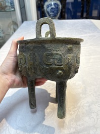 A Chinese archaic bronze food vessel with Taotie design, 'Ding 鼎', late Shang