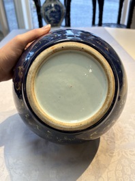 A pair of Chinese gilt-decorated powder-blue-ground covered jars and a famille rose powder-blue-ground jar, 18/19th C.