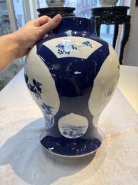 A Chinese blue and white powder-blue-ground 'He Xiangu 何仙姑' vase and cover, 19th C.