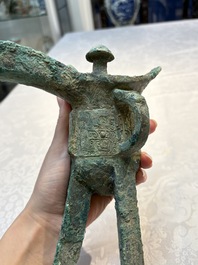 A Chinese archaic bronze wine vessel with Taotie design, Jue 爵, late Shang