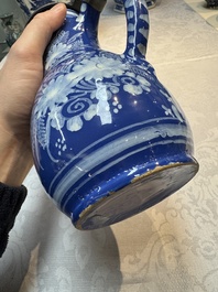 A Nevers white-decorated Persian-blue-ground faience jug with a mounted pewter lid, France, 18th C.