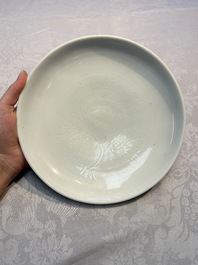 A Chinese Dehua blanc de Chine incised 'Peony' plate, 17/18th C.
