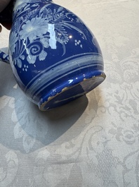 A Nevers white-decorated Persian-blue-ground faience jug with a mounted pewter lid, France, 18th C.