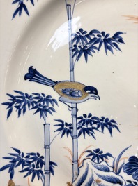 A large Chinese blue and white gilt-decorated dish with birds and insects among bamboo and peonies, Yongzheng