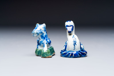 Two polychrome Dutch Delft miniature models of animals, a 'Pineapple' stand and a pair of blue and white plates, 18th C.