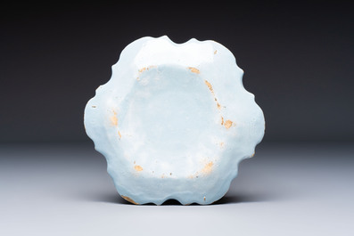 Two polychrome Dutch Delft miniature models of animals, a 'Pineapple' stand and a pair of blue and white plates, 18th C.