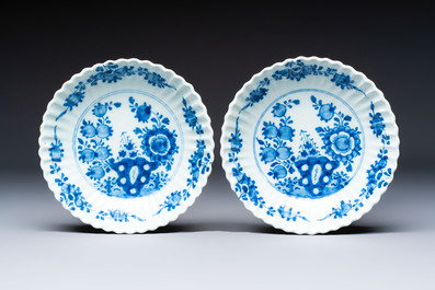 Two polychrome Dutch Delft miniature models of animals, a 'Pineapple' stand and a pair of blue and white plates, 18th C.