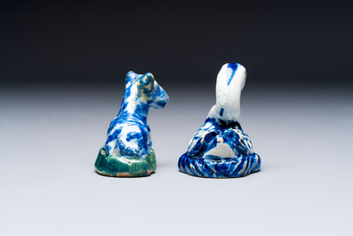 Two polychrome Dutch Delft miniature models of animals, a 'Pineapple' stand and a pair of blue and white plates, 18th C.