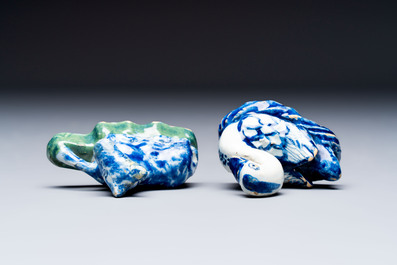 Two polychrome Dutch Delft miniature models of animals, a 'Pineapple' stand and a pair of blue and white plates, 18th C.