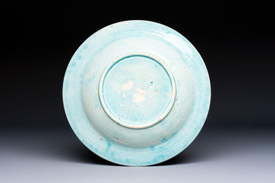 A polychrome Kuthaya pottery Iznik-style turquoise-ground dish, 19th C.