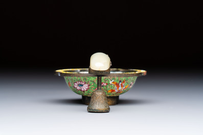 A Chinese celadon jade belt hook mounted as a handle on a Canton enamel bowl, Qing