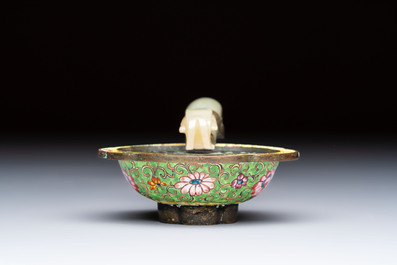 A Chinese celadon jade belt hook mounted as a handle on a Canton enamel bowl, Qing