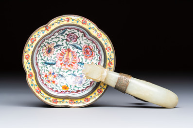 A Chinese celadon jade belt hook mounted as a handle on a Canton enamel bowl, Qing