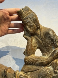 A Chinese sandstone 'Bai Ma Shi Zu 白馬舐足' carving, Northern Wei