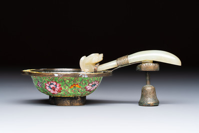 A Chinese celadon jade belt hook mounted as a handle on a Canton enamel bowl, Qing