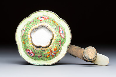 A Chinese celadon jade belt hook mounted as a handle on a Canton enamel bowl, Qing