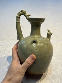 A fine Chinese Yueyao green-glazed chicken-head ewer with dragon-form handle, Southern Dynasties