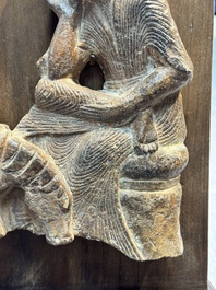 A Chinese sandstone 'Bai Ma Shi Zu 白馬舐足' carving, Northern Wei