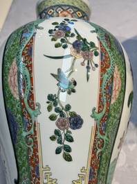 A pair of famille verte-style 'Lotus Pond and Flower Basket' vases and covers, Samson, Paris, 19th C.