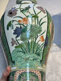 A pair of famille verte-style 'Lotus Pond and Flower Basket' vases and covers, Samson, Paris, 19th C.