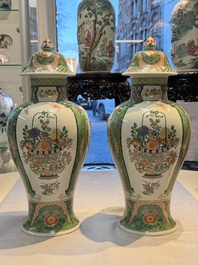 A pair of famille verte-style 'Lotus Pond and Flower Basket' vases and covers, Samson, Paris, 19th C.