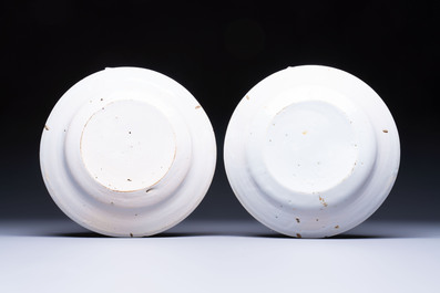 A pair of unusual polychrome Brussels faience plates with fish and cutlery, 18th C.