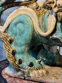 A pair of large Chinese polychrome-glazed Shiwan stoneware Buddhist lions, 19th C.