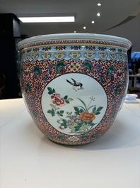 A large Chinese famille rose 'Bird among Flowering Branches' scroll pot, 19th C.