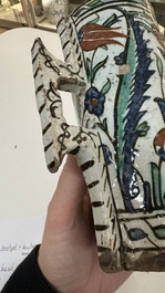 A polychrome Iznik mug, late 16th C.