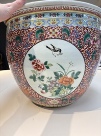 A large Chinese famille rose 'Bird among Flowering Branches' scroll pot, 19th C.