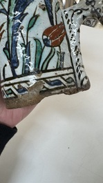 A polychrome Iznik mug, late 16th C.