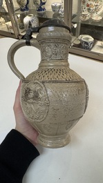 A Siegburg stoneware jug with mounted pewter lid, dated 1594