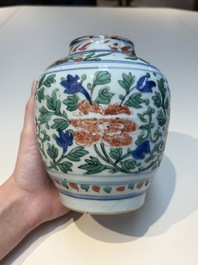 A Chinese wucai &lsquo;Buddhist Lion&rsquo; vase and cover, Transitional period