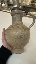A Siegburg stoneware jug with mounted pewter lid, dated 1594