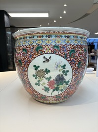 A large Chinese famille rose 'Bird among Flowering Branches' scroll pot, 19th C.