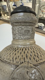 A Siegburg stoneware jug with mounted pewter lid, dated 1594