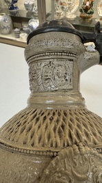 A Siegburg stoneware jug with mounted pewter lid, dated 1594